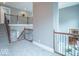 Loft with wrought iron banister overlooking a living room at 633 Foxboro Dr, Avon, IN 46123