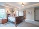 Comfortable main bedroom featuring tray ceilings, carpeted floors, and natural lighting at 633 Foxboro Dr, Avon, IN 46123
