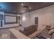 Entertainment room with a large screen, projector, and tiered seating for a cinematic experience at 633 Foxboro Dr, Avon, IN 46123