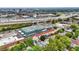 An aerial view showcasing a blend of residential homes, commercial buildings, and transportation routes at 634 Dorman St, Indianapolis, IN 46202