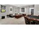 Finished basement living space featuring a comfortable sofa, coffee table, and game table at 634 Dorman St, Indianapolis, IN 46202
