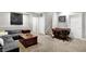 Spacious basement area features a plush grey sofa, coffee table, and a game table with seating at 634 Dorman St, Indianapolis, IN 46202