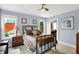 Bedroom with carpet, ceiling fan, three windows and access to a bathroom at 634 Dorman St, Indianapolis, IN 46202