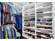 Organized walk-in closet with built-in shelving and ample storage space for clothing and accessories at 634 Dorman St, Indianapolis, IN 46202