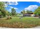 Grassy common area with picnic tables and fire pit offering a relaxing outdoor space at 634 Dorman St, Indianapolis, IN 46202