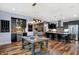 Open concept kitchen and dining area with views into the living room featuring a modern light fixture at 634 Dorman St, Indianapolis, IN 46202