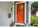 Welcoming front door with sidelights, enhanced by stylish exterior details and lush landscaping at 634 Dorman St, Indianapolis, IN 46202