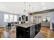 Bright kitchen with a large center island, stainless steel appliances, and breakfast table with lots of sunlight at 634 Dorman St, Indianapolis, IN 46202