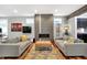 Spacious living room featuring a fireplace, sofas, hardwood floors, and an open layout at 634 Dorman St, Indianapolis, IN 46202