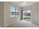Bright bedroom featuring a large window and a sliding glass door at 6997 Harbour Woods Overlook, Noblesville, IN 46062