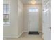 Bright entryway featuring neutral walls, tile flooring, and a white front door at 6997 Harbour Woods Overlook, Noblesville, IN 46062