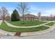 A well-maintained home is seen on a corner lot featuring lush green grass at 6997 Harbour Woods Overlook, Noblesville, IN 46062