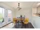 Eat-in kitchen/dining room features walkout to fenced in backyard and patio at 7208 Long Boat Dr, Indianapolis, IN 46250