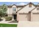 Inviting townhome featuring an attached garage, neutral siding and nicely manicured landscaping at 7208 Long Boat Dr, Indianapolis, IN 46250