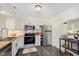 Bright kitchen featuring modern appliances, neutral cabinets, and butcher block countertops at 7208 Long Boat Dr, Indianapolis, IN 46250
