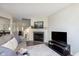 Comfortable living room with cozy fireplace, neutral decor, and plenty of natural light at 7208 Long Boat Dr, Indianapolis, IN 46250