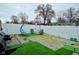 Landscaped backyard with gravel, artificial turf, barbecue, and outdoor seating at 7527 Derek Dr, Camby, IN 46113