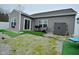 Backyard featuring a well-maintained yard with artificial turf, storage shed, and barbecue area at 7527 Derek Dr, Camby, IN 46113