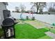 Backyard featuring a barbecue, seating, and artificial turf at 7527 Derek Dr, Camby, IN 46113