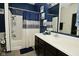 Bright bathroom featuring a shower and bathtub combo with a vanity and framed mirror at 7527 Derek Dr, Camby, IN 46113