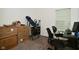 Bedroom with an inversion table, boxes, and a desk by the window at 7527 Derek Dr, Camby, IN 46113