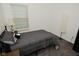 Bedroom with window, lamp, bed, and dark flooring at 7527 Derek Dr, Camby, IN 46113