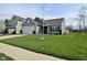Lovely home with a well-maintained lawn and an attached two-car garage at 7527 Derek Dr, Camby, IN 46113