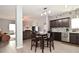 Open concept kitchen with an eating area and view of the living room at 7527 Derek Dr, Camby, IN 46113