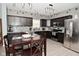 Charming kitchen with stainless steel appliances and dark wood cabinets at 7527 Derek Dr, Camby, IN 46113