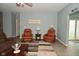 Inviting living room featuring recliners, modern flooring, stylish decor, and natural light at 7527 Derek Dr, Camby, IN 46113