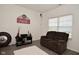 Comfortable living room with neutral walls, plush sofa, and natural light at 7527 Derek Dr, Camby, IN 46113