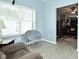 Bright living room features natural light, chair, and wood grain flooring at 7527 Derek Dr, Camby, IN 46113