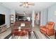 An open-concept space with the living room flowing seamlessly into the kitchen and dining area at 7527 Derek Dr, Camby, IN 46113