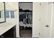 Walk-in closet with custom shelving and ample storage space, located adjacent to the en suite bathroom at 7527 Derek Dr, Camby, IN 46113
