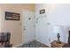 View of the home's entry, with a coat rack, interior door and decorations on the wall at 768 Pine Lake Dr, Greenwood, IN 46143
