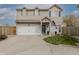 Charming two-story home with an attached garage, manicured lawn, and an American flag at 768 Pine Lake Dr, Greenwood, IN 46143