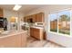 Bright kitchen with wood cabinets, laminate countertops, stainless appliances and large window above the sink at 768 Pine Lake Dr, Greenwood, IN 46143