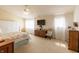 Inviting main bedroom with large windows, ceiling fan, plush carpet and ample natural light at 768 Pine Lake Dr, Greenwood, IN 46143