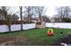 Lush backyard with a storage shed, surrounded by a white fence, perfect for outdoor activities and relaxation at 7809 Bryden Dr, Fishers, IN 46038