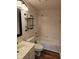 Renovated bathroom features modern fixtures, shelving, and a shower-tub combo at 7809 Bryden Dr, Fishers, IN 46038