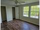 Spacious bedroom featuring hardwood floors, closet, and lots of natural light at 7809 Bryden Dr, Fishers, IN 46038