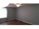 Empty bedroom featuring hardwood floors, a ceiling fan, and window at 7809 Bryden Dr, Fishers, IN 46038