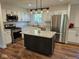 Well-lit kitchen featuring a center island, stainless steel appliances, and granite countertops at 7809 Bryden Dr, Fishers, IN 46038