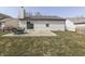 A large backyard featuring a patio, furniture, and a privacy fence at 855 Queensgate Dr, Greenwood, IN 46143