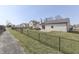 The backyard features a fence, a concrete patio, and a grassy area at 855 Queensgate Dr, Greenwood, IN 46143