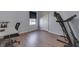 Spare bedroom featuring wood floors, a window, and a treadmill at 855 Queensgate Dr, Greenwood, IN 46143