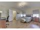 Bright bedroom featuring wood floors, neutral walls, a chandelier, and a connected bathroom at 855 Queensgate Dr, Greenwood, IN 46143