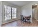 Bright dining area with a large window and a wooden table with black chairs at 855 Queensgate Dr, Greenwood, IN 46143