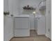 Laundry room with a white washer and dryer with storage shelf above at 855 Queensgate Dr, Greenwood, IN 46143