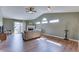 Spacious living room featuring a fireplace, high ceilings, and sliding glass doors to the backyard at 855 Queensgate Dr, Greenwood, IN 46143